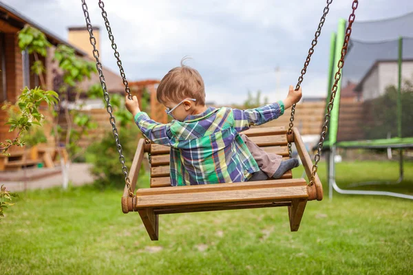 Child Swinging Swing Backyard — Stock Photo, Image