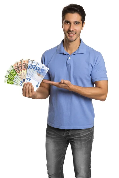 Hombre sosteniendo / mostrando billetes en euros de dinero —  Fotos de Stock