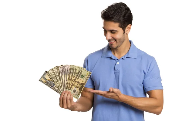 Hombre sosteniendo / mostrando billetes de dólar —  Fotos de Stock