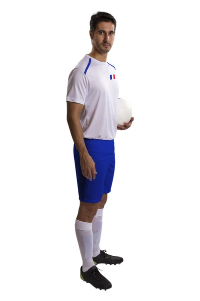 Fransız futbol oyuncusu topu beyaz arka plan üzerinde tutarak. — Stok fotoğraf