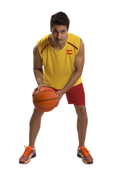 İspanyol basketbolcu topu ile. — Stok fotoğraf