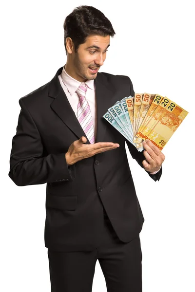 Business man holding brazilian money / real — Stock Photo, Image