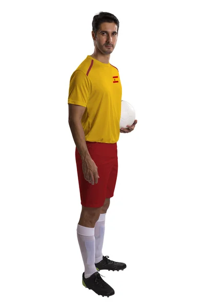 Испанский футболист держит мяч на белом фоне — стоковое фото