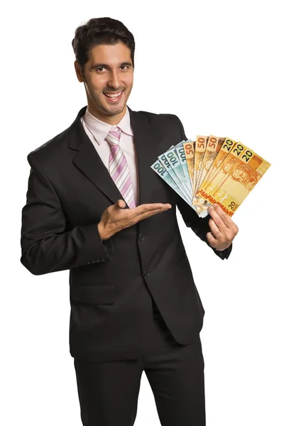 Affärsman holding brasilianska pengar / real — Stockfoto