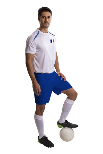 Fransız futbol oyuncusu topu beyaz arka plan üzerinde tutarak. — Stok fotoğraf