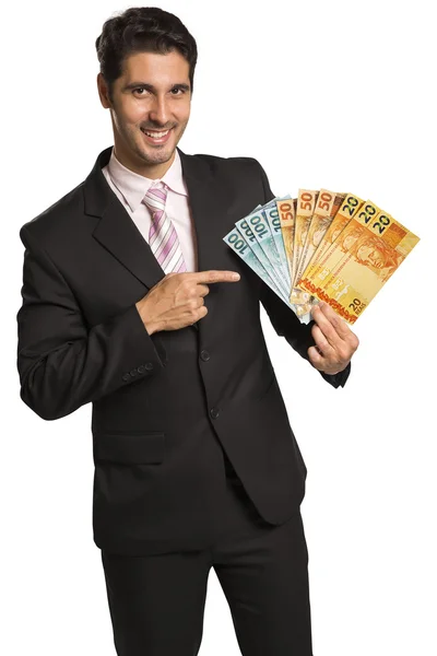 Homem de negócios segurando dinheiro brasileiro / real — Fotografia de Stock