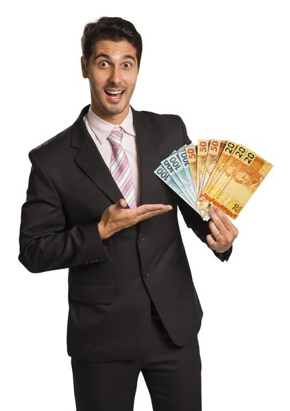 Affärsman holding brasilianska pengar / real — Stockfoto