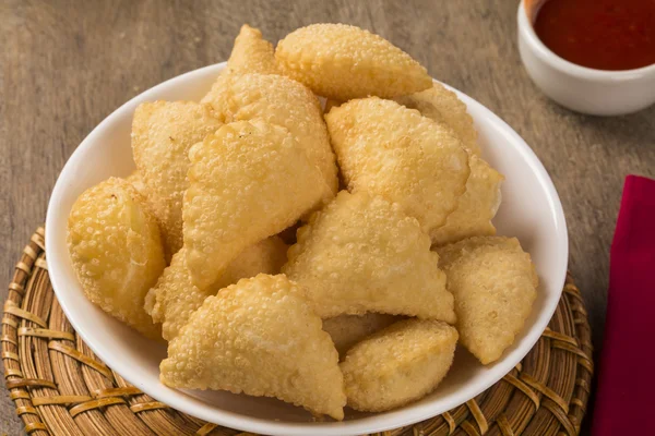 Pastel, a Brazilian snack, with a bar in the background. Cheese — Stock Photo, Image