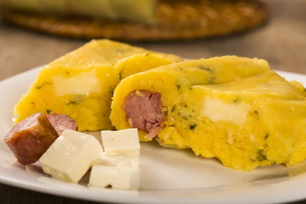 Salty Pamonha with sausage and cheese - typical food of green co — Stock Photo, Image