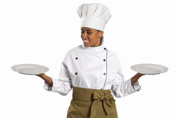 Chef mostrando el plato vacío. Mujer cocinera o chef sirviendo plato vacío —  Fotos de Stock