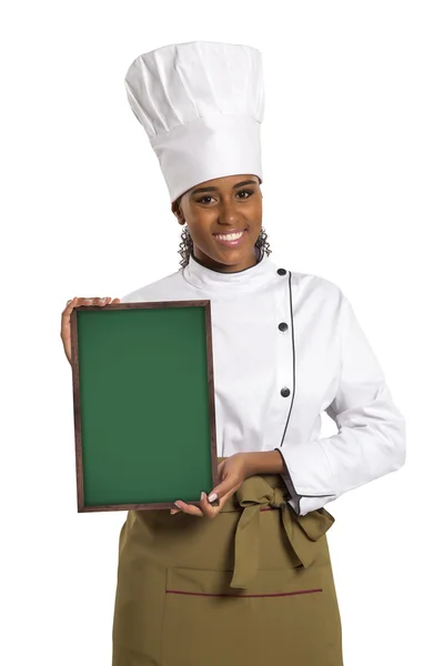 Chefe. Mulher cozinheiro mostrando menu vazio quadro com espaço de cópia . — Fotografia de Stock