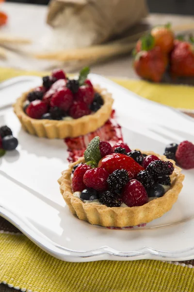 Two Fruit Pies with raspberries, blueberries and mulberries in a — Stock Photo, Image