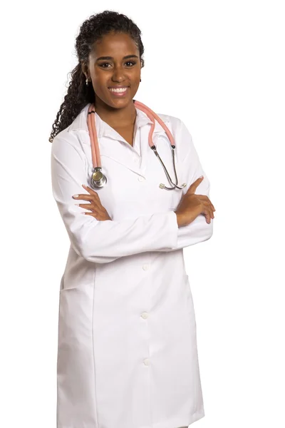 Portrait of beautiful African Brazilian doctor or nurse with arms crossed isolated over white background — Stock Photo, Image