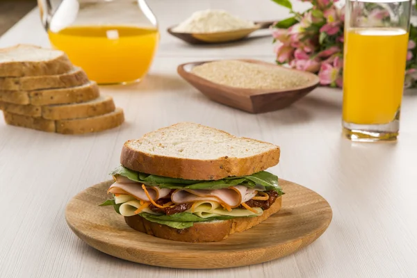 Sandwich on a white plate with turkey breast. — Stock Photo, Image