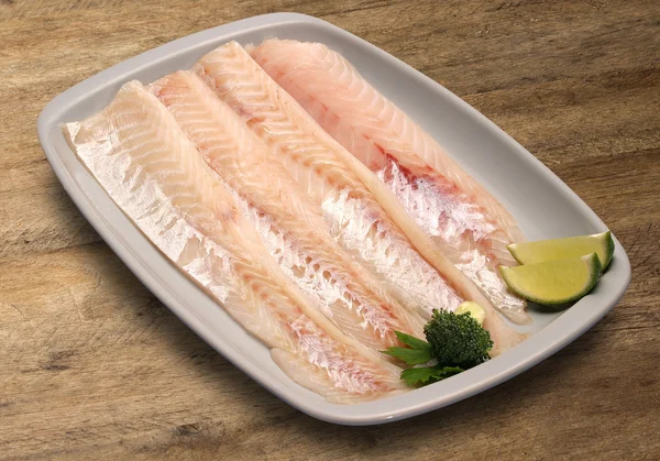 Raw fish on wooden background. — Stock Photo, Image
