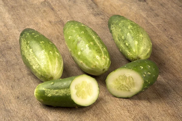 Fresh cucumber on the wooden table. — Stock Photo, Image