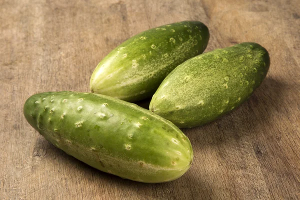 Fresh cucumber on the wooden table. — Stock Photo, Image