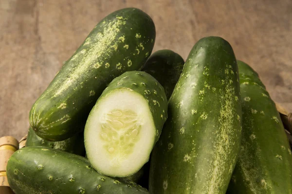 Fresh cucumber on the wooden table. — Stock Photo, Image