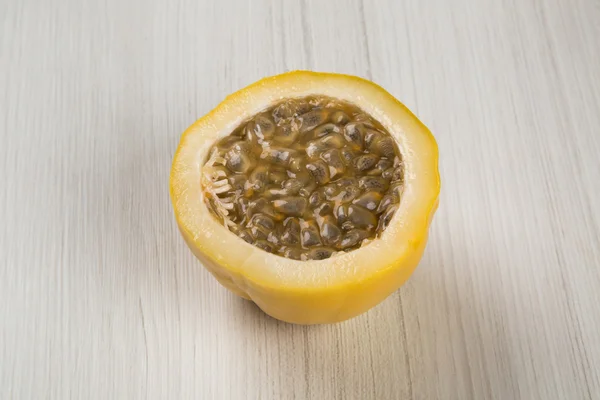 Close up of some passion fruits over a white background.