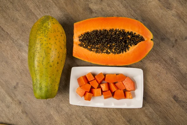 Fresh cut juicy tropical papaya mamao fruit with seeds at Brazil