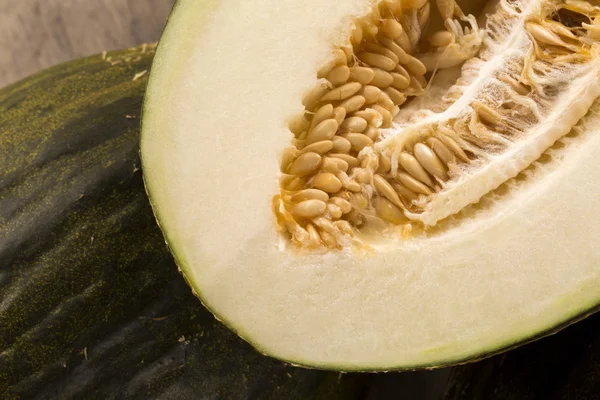 Some melons over a wooden surface — Stock Photo, Image
