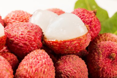 fresh lychees on wooden surface. clipart