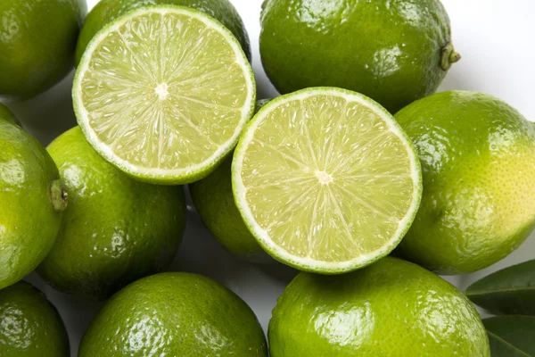 Fresh citrus lime with mint close up on white background. — Stock Photo, Image