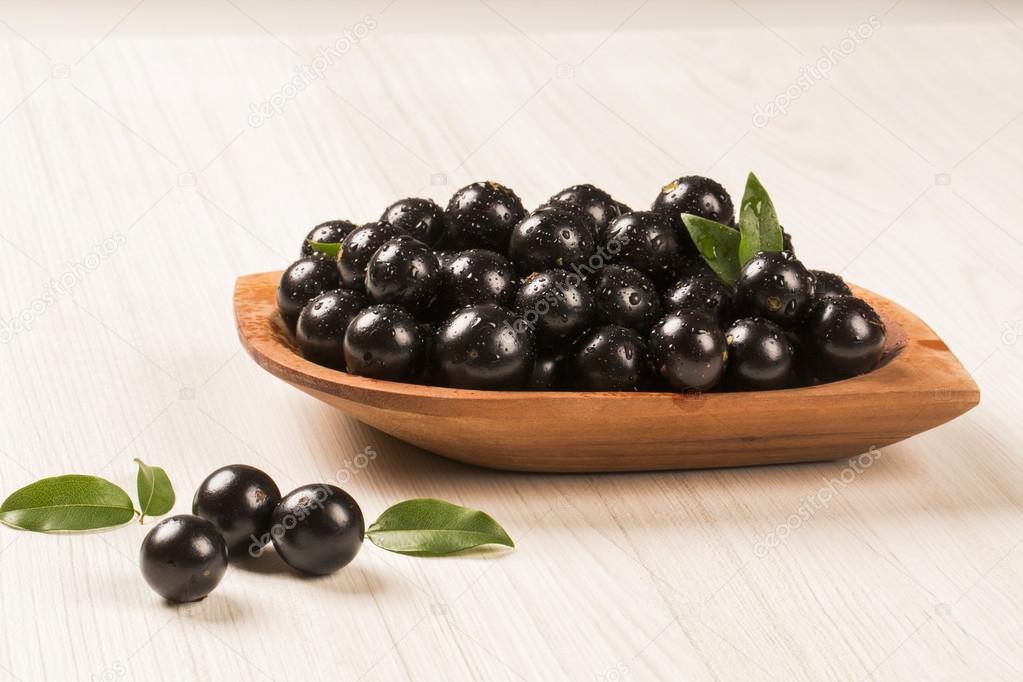 Berry Jaboticaba in bowl on wooden table