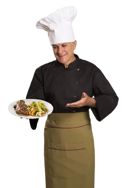 Chef holding plate with roasted meat — Stock Photo, Image