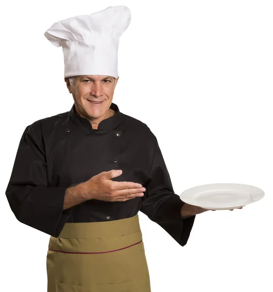 Confident mature chef in black uniform holding empty plate. — Stock Photo, Image