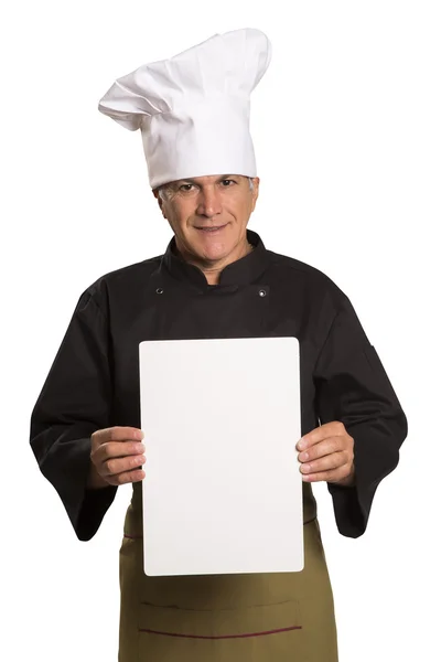 Maturo uomo chef in uniforme pollici su e mostrando vuoto visita carta . — Foto Stock