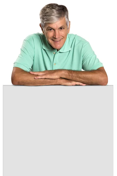 Portrait of a mature man holding a blank panel. — Stock Photo, Image