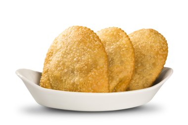 Deep fried stuffed pastry. Brazilian food pasteis on the backgro clipart