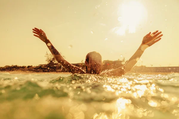 Sexy bikini girl swim sea waves splash vintage tone — Stock Photo, Image