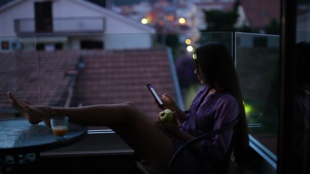 Woman using smartphone at night — Stock Video