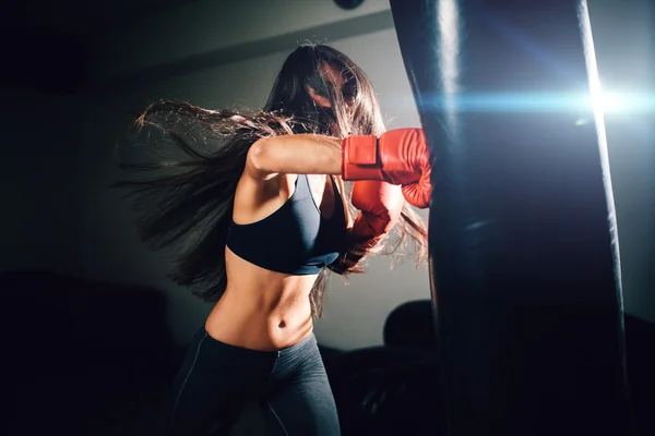 Sexy fighter girl punching actively — Stock Photo, Image