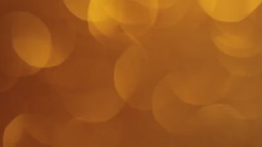 Zarif altın parıltısı Bokeh arka planı