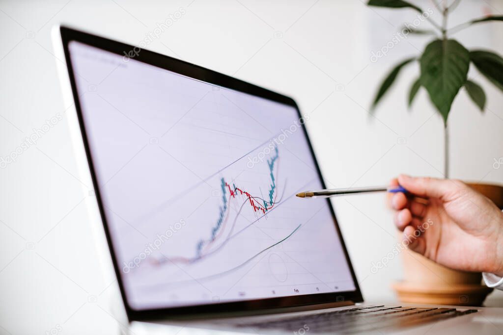 bitcoin price graph data trend analysis on laptop screen