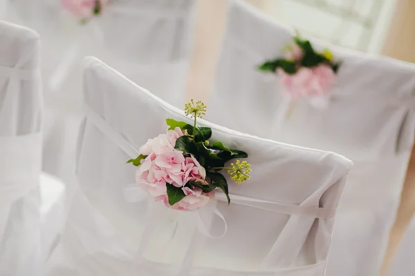 Wedding chair cover with pink flowers — Stock Photo, Image