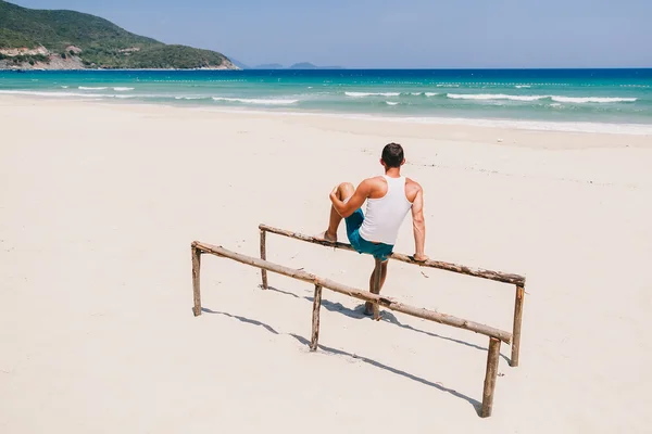 Freedom man on the beach back view — Stock Photo, Image