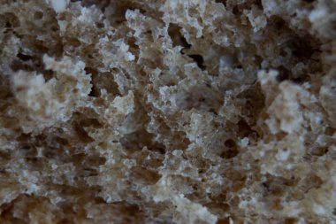 Siyah ekmek. Ekmek desenli makro. Ekmek yüzeyine yakın çekim.