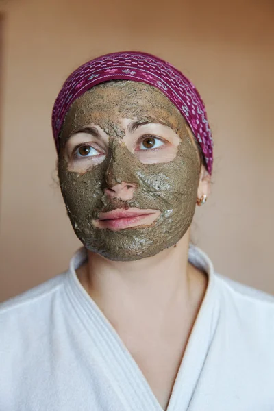 The woman in clay mask