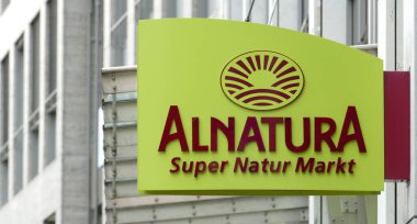 Berlin, Germany, May 4, 2021, sign with Alnatura logo above organic supermarket of the same name. clipart