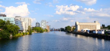 Berlin, Germany, June 2nd 2021, view over the river Spree between Kreuzberg and Friedrichshain with Oberbaumbruecke in the background
