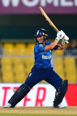 Alice Capsey of England hits a four during the ICC Women's World Cup match England Women vs Bangladesh Women at ACA Barsapara Cricket Stadium, Guwahati, Assam/ India, 7th October 2025 