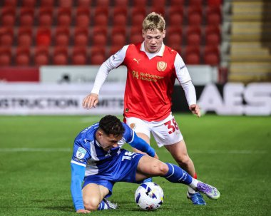 Kieron Morris of Oldham Athletic and Kane Richardson of Rotherham United battle for the ball during the The Vertu Trophy Northern Group E match Rotherham United vs Oldham Athletic at New York Stadium, Rotherham, United Kingdom, 7th October 2025 