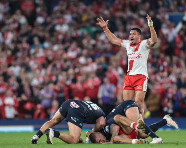 Tyrone May of Hull KR receives a heavy tackle off Brad O'neill of Wigan Warriors during the 2025 Betfred Super League Grand Final Hull KR v Wigan Warriors at Old Trafford, Manchester, United Kingdom, 11th October 2025