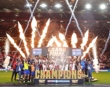 Elliot Minchella of Hull KR and his team mates and staff lift the Grand Final Trophy during the 2025 Betfred Super League Grand Final Hull KR v Wigan Warriors at Old Trafford, Manchester, United Kingdom, 11th October 2025       