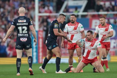 Joe Burgess of Hull KR is confronted by Brad O'neill of Wigan Warriors after a heated tackle during the 2025 Betfred Super League Grand Final Hull KR v Wigan Warriors at Old Trafford, Manchester, United Kingdom, 11th October 2025 
