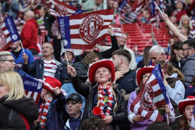 Wigan fans wave their flags during the 2025 Betfred Super League Grand Final Hull KR v Wigan Warriors at Old Trafford, Manchester, United Kingdom, 11th October 2025 